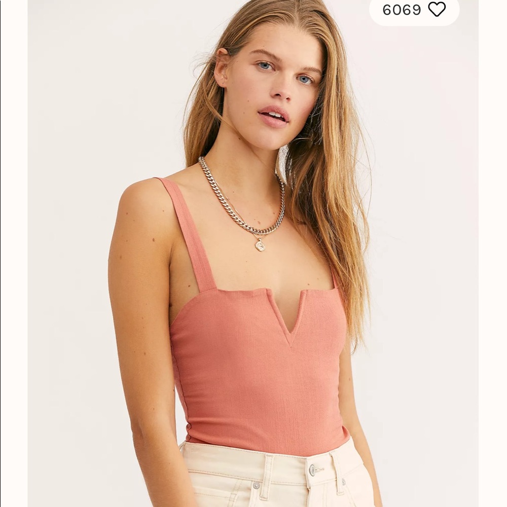 NWOT Free People bodysuit. Never worn. Size S